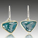 A pair of aquamarine earrings set in 18k yellow gold with sterling silver wires.