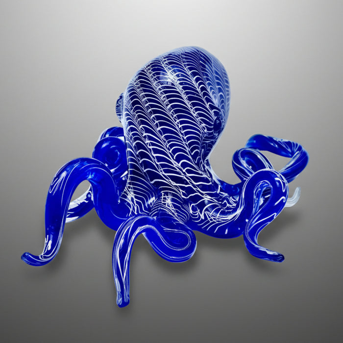 Blue glass octopus sculpture on a white background