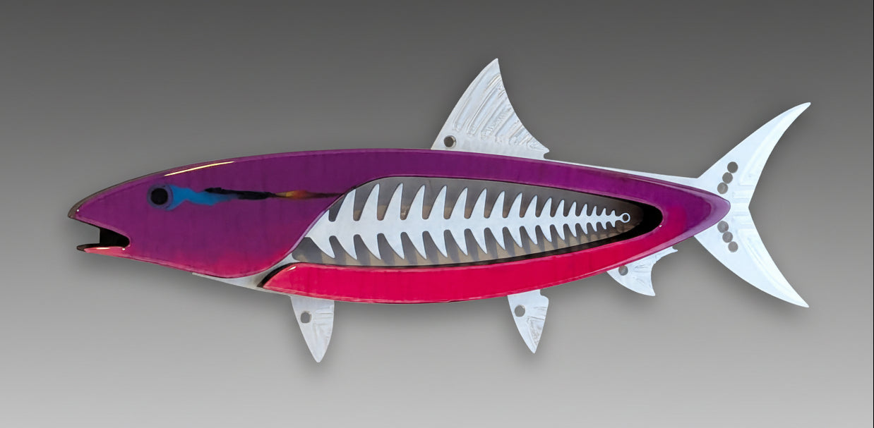 A mixed media sculpture of a bonefish with a primarily pink body and silver aluminum accents, mounted on a wall.