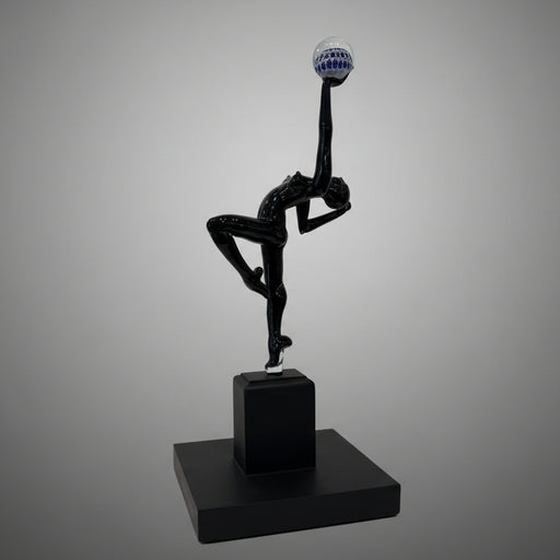 Black abstract sculpture on a gray background