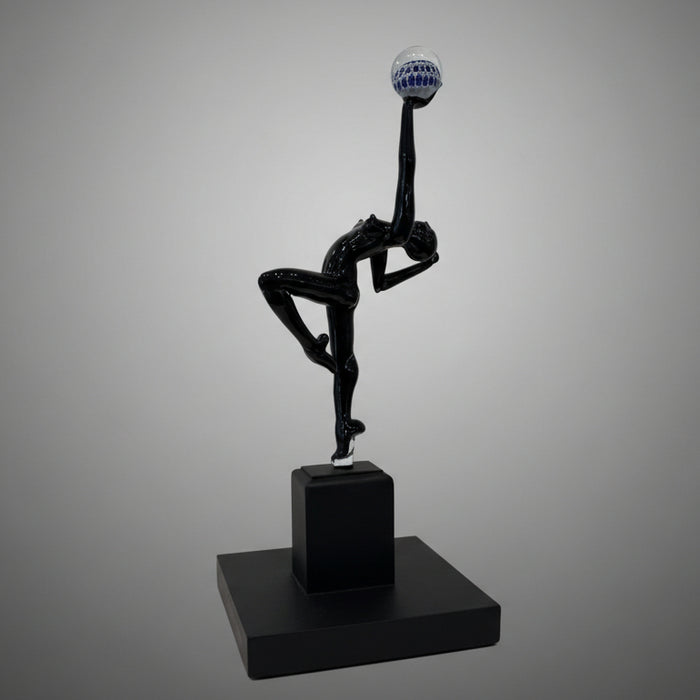 Black abstract sculpture on a gray background