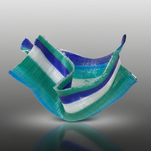 Stack of green, blue, and white striped ribbons on a gray background