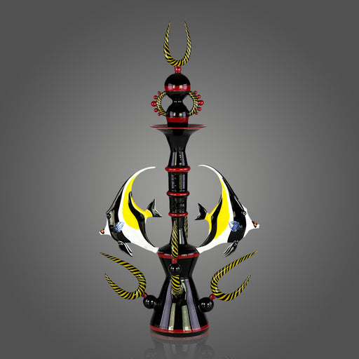 Decorative sculpture with a central pole, fish figures, and decorative elements on a gray background