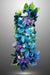 A handmade wall lamp featuring a design with glass flowers, bubbles, and doves in various shades of blue, pink, and green, with white peace doves.