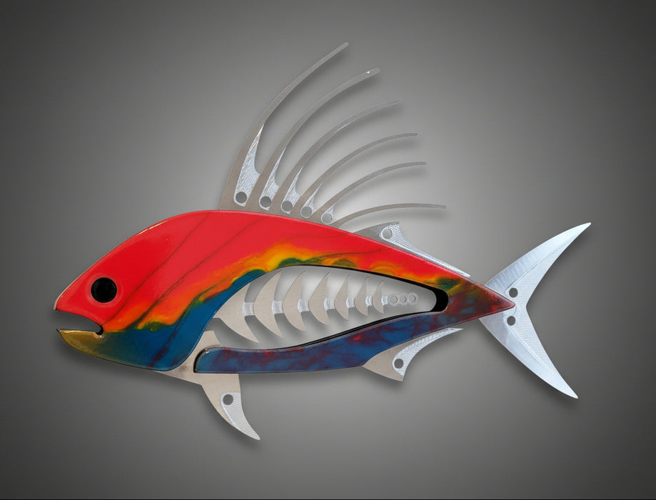 Colorful fish-shaped wall art with a skeleton design on a beige background