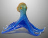 Glass octopus sculpture with gray background
