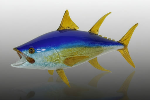 Blown glass sculpture of a blue and yellow fish 