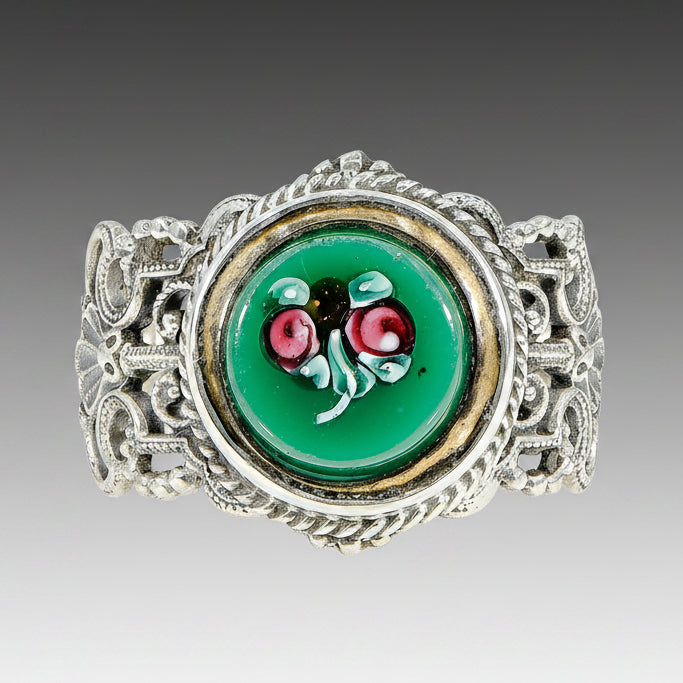 Antique green glass button ring with hand painted roses, set in sterling silver mounting, Victorian era.