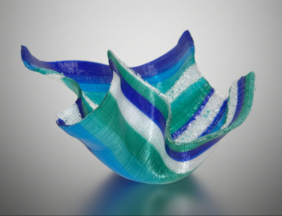 Blue and green tapestry sculpture on a gray background