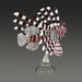 Glass sculpture of a lionfish on a stand against a dark background