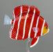 Red and white fish-shaped object on a gray background
