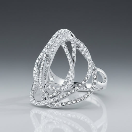A handcrafted gold ring with a pave of round, brilliant cut diamonds creating a tangle pattern design.