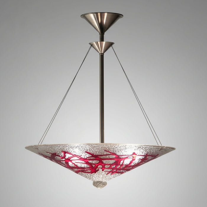 A ceiling-mounted chandelier with a conical shape featuring a red and white patterned glass shade, with metal fittings in a dark setting.