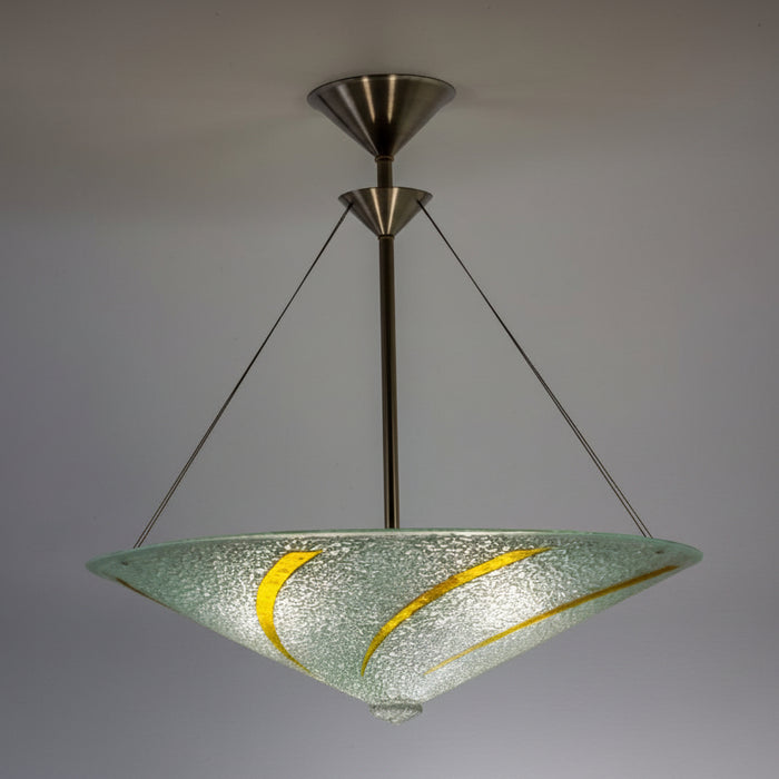A round chandelier with clear glass and gold accents, suspended by metal cables.