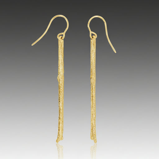 A pair of 19k yellow gold twig earrings with a textured design, resembling an olive branch.