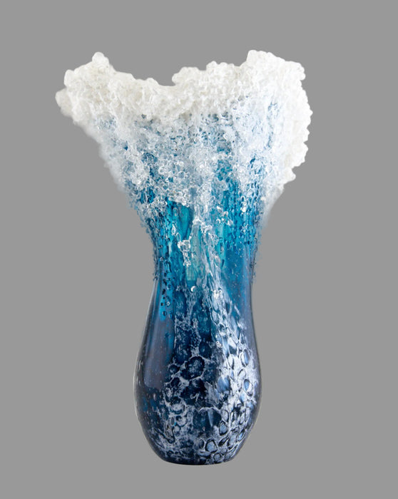 Vase with blue and white textured design on a gray background