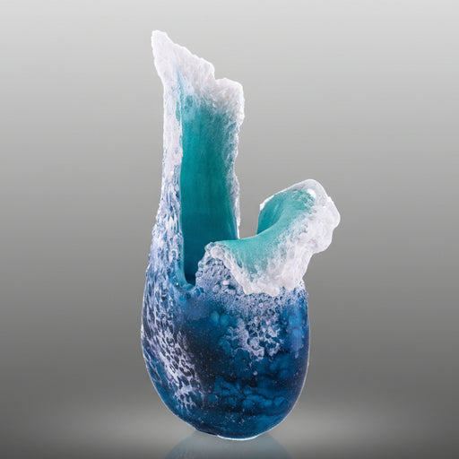 Blue and white ceramic sculpture on a gray background