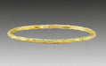 A textured gold bracelet with a solid pattern, likely made from 19k yellow gold, as part of Aaron Henry's Signature Arbor Collection.